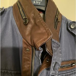 Mens spring jacket: denim/jean with leather and zipper embellishments